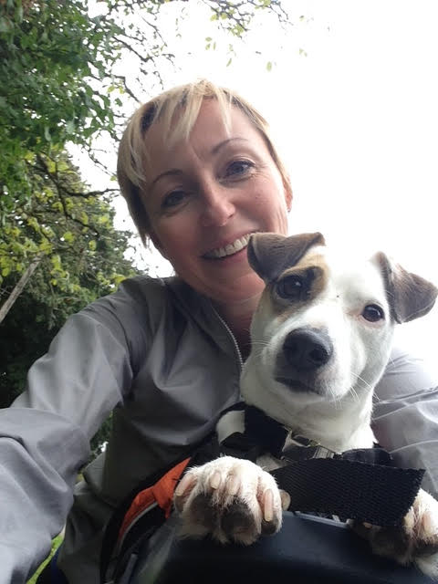 Close-up of owner and dog sitting in its Buddyrider bike dog carrier